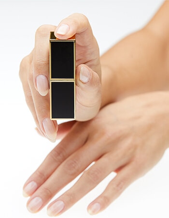 Hand Model holding lipstick product shot